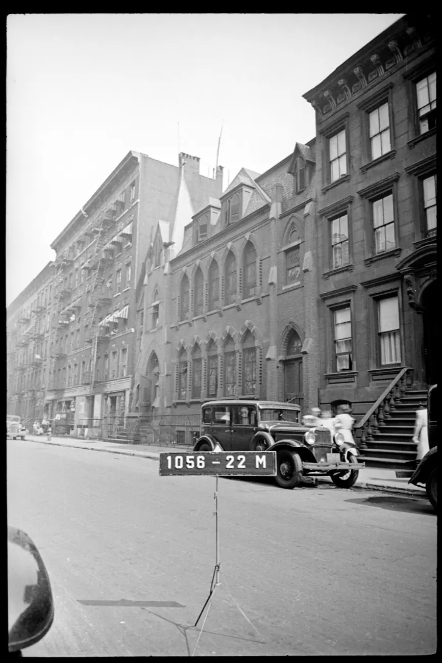 St. Clement’s Church on West 46th Street in 1940, with Gothic arched windows, dormers, and a car parked at the curb